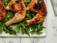 an image of two cooked chicken with veg